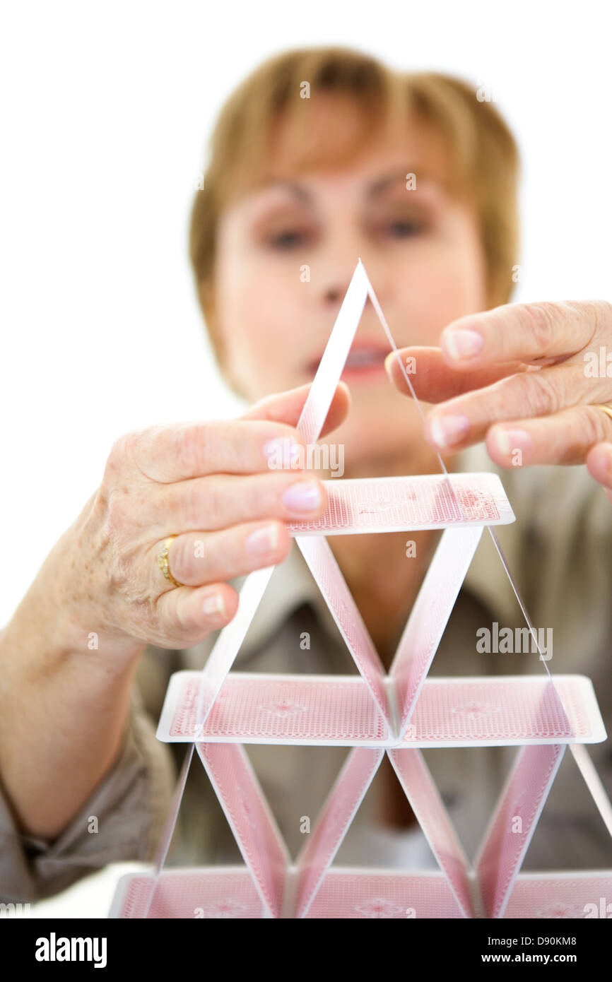 Woman Building A House Of Cards Stock Photo Alamy